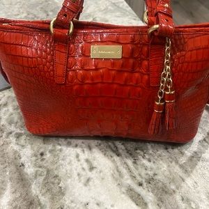 Brahmin red handbag with shoulder straps and hand held straps